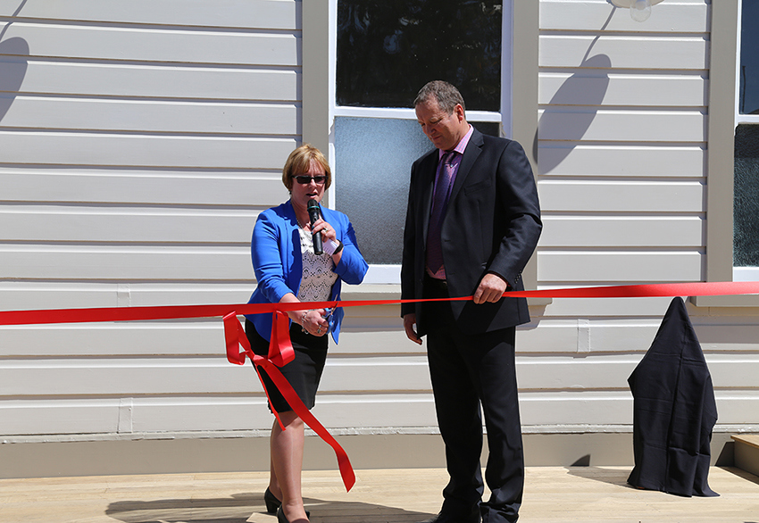 Barbara Kuriger and Mayor Brian Hanna cut the ribbon at the opening of the railway buildings